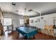 Spacious recreation room with a pool table, seating, and ample natural light for community enjoyment at 3307 E Kings Ave, Phoenix, AZ 85032