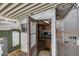 View of outdoor shed with an open door and shelving for storage at 3307 E Kings Ave, Phoenix, AZ 85032
