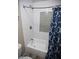 Beautiful bathroom featuring tiled walls, tub, and a patterned shower curtain at 3314 E Page Ave, Gilbert, AZ 85234