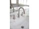 Close up of bathroom sink with brushed metal faucet and marble countertop at 3314 E Page Ave, Gilbert, AZ 85234