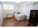 Bright bedroom features a comfortable bed and a charming accent dresser at 3314 E Page Ave, Gilbert, AZ 85234