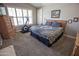 Neutral bedroom with large windows and wood furniture at 3314 E Page Ave, Gilbert, AZ 85234