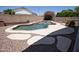 Backyard with large pool and travertine decking at 3314 E Page Ave, Gilbert, AZ 85234
