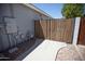 Gated side yard with concrete pathway and river rock at 3314 E Page Ave, Gilbert, AZ 85234