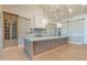 A spacious kitchen with a large island and contemporary pendant lighting at 3506 N Crystal Peak Cir, Mesa, AZ 85207