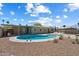 Relaxing backyard with a refreshing pool, lounge chairs, and a covered patio at 3814 E Poinsettia Dr, Phoenix, AZ 85028