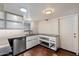 Well-lit kitchen with stainless steel dishwasher and plenty of cabinet space at 3814 E Poinsettia Dr, Phoenix, AZ 85028