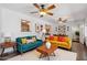 Bright living area with colorful furniture and decor adjacent to a dining area at 3814 E Poinsettia Dr, Phoenix, AZ 85028