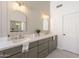 Modern bathroom featuring double vanity, quartz countertop, framed mirrors, and stylish gray cabinetry at 3837 E Windsong Dr, Phoenix, AZ 85048