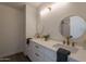 Bathroom featuring double sinks with round mirrors and brushed gold hardware at 3837 E Windsong Dr, Phoenix, AZ 85048