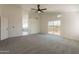 Open bedroom with carpet, ceiling fan, deck access, and ensuite bathroom featuring a soaking tub at 3837 E Windsong Dr, Phoenix, AZ 85048