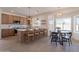 Well-lit kitchen with modern appliances, center island, and inviting breakfast nook with backyard views at 3837 E Windsong Dr, Phoenix, AZ 85048