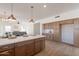 Gourmet kitchen features a large island, stainless steel appliances, and ample cabinet storage at 3837 E Windsong Dr, Phoenix, AZ 85048