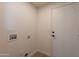 Laundry room featuring tile flooring and a white door to access another area at 3837 E Windsong Dr, Phoenix, AZ 85048