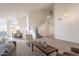 Open-concept space with living room, dining area, and elegant staircase at 3837 E Windsong Dr, Phoenix, AZ 85048