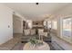 Open floor plan from the living room showcasing the kitchen with dining and access to the backyard at 3837 E Windsong Dr, Phoenix, AZ 85048