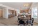 Spacious open-plan living and eat-in kitchen area with wood-look flooring and lots of natural light at 3837 E Windsong Dr, Phoenix, AZ 85048