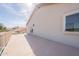 Patio with building wall and a beautiful landscape background at 3837 E Windsong Dr, Phoenix, AZ 85048