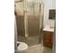 Functional bathroom featuring a glass-enclosed shower, sink, and toilet at 4065 E University Dr # 155, Mesa, AZ 85205