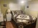 Cozy bedroom featuring a comfortable bed with stylish patterned quilt at 4065 E University Dr # 155, Mesa, AZ 85205