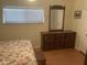 Bedroom featuring natural light, wooden floors and a classic dresser at 4065 E University Dr # 155, Mesa, AZ 85205