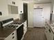 Efficient kitchen with gas range, bright cabinets, and durable countertops at 4065 E University Dr # 155, Mesa, AZ 85205