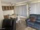 Living room and dining area with natural light and hardwood floors at 4065 E University Dr # 155, Mesa, AZ 85205