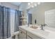 Bathroom featuring a double sink vanity, modern fixtures, stylish mirror, and blue decor at 40848 W Hillman Dr, Maricopa, AZ 85138