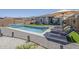 Backyard pool and spa area featuring lounge chairs and a well-maintained outdoor space at 40848 W Hillman Dr, Maricopa, AZ 85138