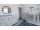 Cozy Bedroom with crib, changing table, closet, and stylish decor at 4313 E Briarwood Ter, Phoenix, AZ 85048