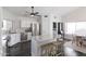 Modern kitchen featuring white cabinetry, stainless steel appliances, and a granite-topped island at 4313 E Briarwood Ter, Phoenix, AZ 85048