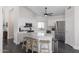 Well-appointed kitchen with white cabinets, stainless steel appliances, and a center island with seating at 4313 E Briarwood Ter, Phoenix, AZ 85048