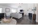 Bright living room features vaulted ceilings, fireplace, and dark wood floors at 4313 E Briarwood Ter, Phoenix, AZ 85048