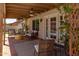 Inviting covered patio with comfortable seating, ceiling fans, and view of the pool at 4313 E Briarwood Ter, Phoenix, AZ 85048