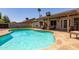 Beautiful private pool with covered patio area and lush landscaping in backyard at 4313 E Briarwood Ter, Phoenix, AZ 85048