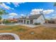 Expansive backyard featuring a well-maintained lawn, mature trees, and sparkling pool at 4340 E Nisbet Rd, Phoenix, AZ 85032