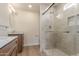 Bathroom featuring double sinks with a marble countertop and a tiled shower at 4340 E Nisbet Rd, Phoenix, AZ 85032