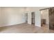Bedroom featuring wood-look flooring and ensuite with a sliding barn door to a bathroom at 4340 E Nisbet Rd, Phoenix, AZ 85032