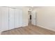 Bedroom featuring closet with bifold doors and light hardwood flooring throughout at 4340 E Nisbet Rd, Phoenix, AZ 85032