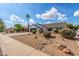 Inviting single-Gathering home with a well-manicured lawn and lush desert landscaping at 4340 E Nisbet Rd, Phoenix, AZ 85032
