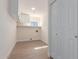 Spacious laundry room with storage cabinets, folding counter and wood laminate flooring at 4340 E Nisbet Rd, Phoenix, AZ 85032