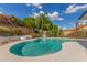 Private backyard oasis with sparkling pool surrounded by lush landscaping at 4340 E Nisbet Rd, Phoenix, AZ 85032