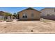 Wide backyard with a small fire pit surrounded by concrete at 4432 W Pleasant Ln, Laveen, AZ 85339
