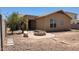 Backyard featuring a fire pit surrounded by concrete and small plants at 4432 W Pleasant Ln, Laveen, AZ 85339