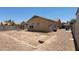 Large backyard, fully fenced with a stone fire pit at 4432 W Pleasant Ln, Laveen, AZ 85339