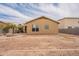 Backyard features desert landscaping and a charming fire pit area at 4432 W Pleasant Ln, Laveen, AZ 85339
