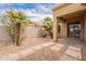 The backyard features desert landscaping, concrete pavers, and a covered patio at 4432 W Pleasant Ln, Laveen, AZ 85339