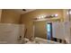 Bathroom with a tub and a double sink vanity at 4432 W Pleasant Ln, Laveen, AZ 85339