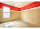 A bedroom with a window and neutral walls is ready for new decor at 4432 W Pleasant Ln, Laveen, AZ 85339