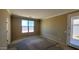 Bedroom features a window and door leading to backyard at 4432 W Pleasant Ln, Laveen, AZ 85339